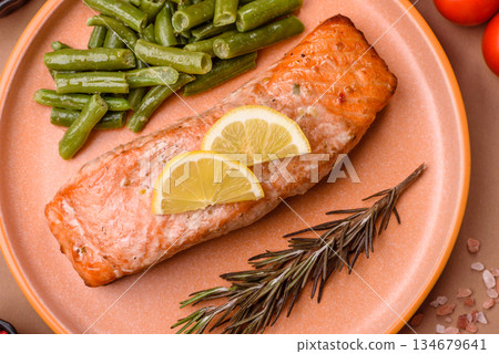 Fish, grilled salmon fillet, healthy food, seafood. Grilled salmon fillet as a background 134679641