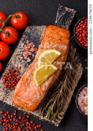 Fish, grilled salmon fillet, healthy food, seafood. Grilled salmon fillet as a background 134679654