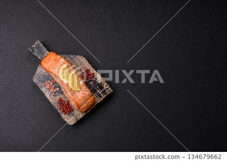 Fish, grilled salmon fillet, healthy food, seafood. Grilled salmon fillet as a background 134679662