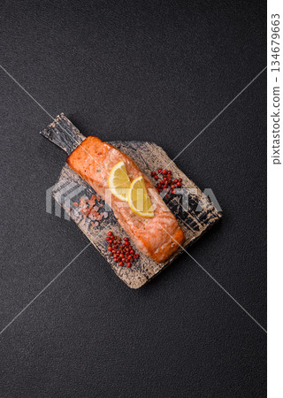 Fish, grilled salmon fillet, healthy food, seafood. Grilled salmon fillet as a background 134679663