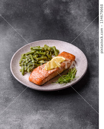 Fish, grilled salmon fillet, healthy food, seafood. Grilled salmon fillet as a background 134679668