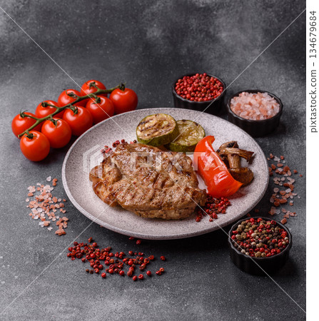 Grilled beef or pork steak, healthy restaurant food for lunch. Barbecue steak as a background 134679684