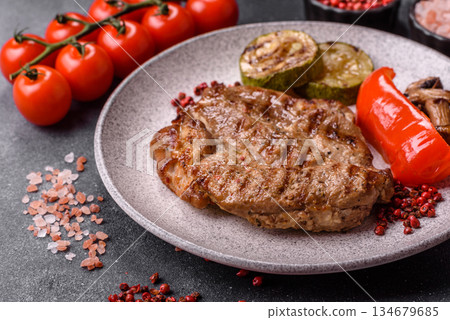 Grilled beef or pork steak, healthy restaurant food for lunch. Barbecue steak as a background 134679685