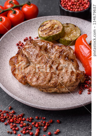 Grilled beef or pork steak, healthy restaurant food for lunch. Barbecue steak as a background 134679687