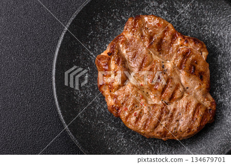 Grilled beef or pork steak, healthy restaurant food for lunch. Barbecue steak as a background 134679701
