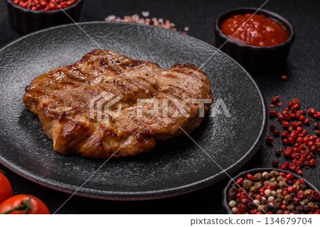 Grilled beef or pork steak, healthy restaurant food for lunch. Barbecue steak as a background 134679704