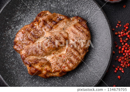 Grilled beef or pork steak, healthy restaurant food for lunch. Barbecue steak as a background 134679705