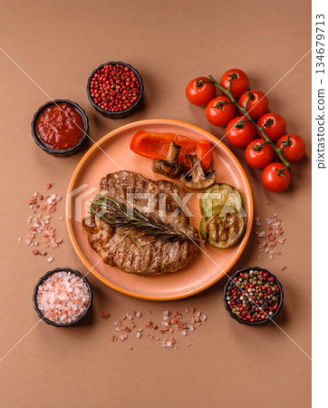 Grilled beef or pork steak, healthy restaurant food for lunch. Barbecue steak as a background 134679713