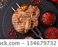 Grilled beef or pork steak, healthy restaurant food for lunch. Barbecue steak as a background 134679732