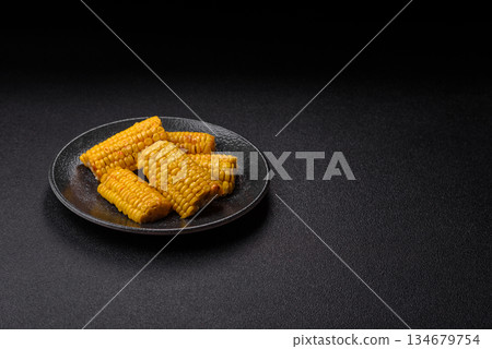 Corn cob cooked in chunks, vegetables, healthy vegetarian food. Boiled corn as a background 134679754