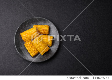 Corn cob cooked in chunks, vegetables, healthy vegetarian food. Boiled corn as a background Corn cob cooked in chunks, vegetables, healthy vegetarian food. Boiled corn as a background 134679755