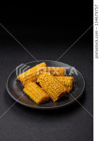 Corn cob cooked in chunks, vegetables, healthy vegetarian food. Boiled corn as a background Corn cob cooked in chunks, vegetables, healthy vegetarian food. Boiled corn as a background 134679757