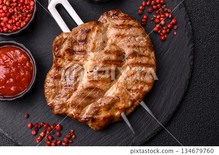 Grilled beef or pork steak, healthy restaurant food for lunch. Barbecue steak as a background 134679760