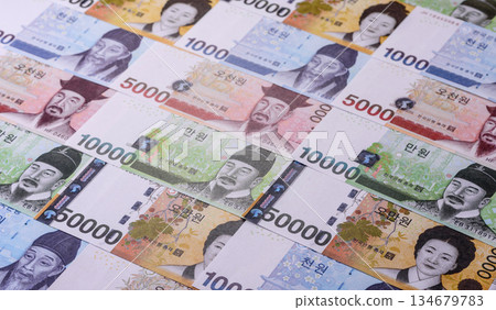 Korean paper money, won, and cash banknotes for financial transactions. Korean money Korean paper money, won, and cash banknotes for financial transactions. Korean money 134679783