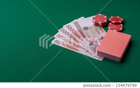 Casino game in the South Korea, won money, chips, cards. Gambling in casinos in the Korea Casino game in the South Korea, won money, chips, cards. Gambling in casinos in the Korea 134679799