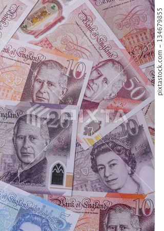 Britain paper money, pound sterling, cash banknotes for financial transactions. Britain money Britain paper money, pound sterling, cash banknotes for financial transactions. Britain money 134679855