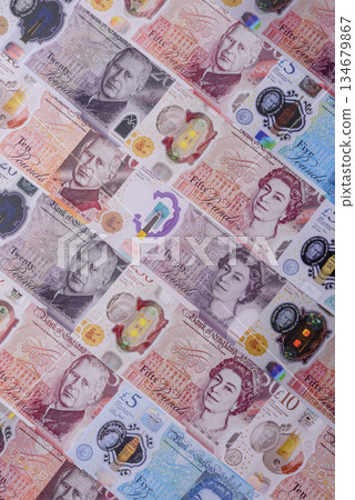Britain paper money, pound sterling, cash banknotes for financial transactions. Britain money Britain paper money, pound sterling, cash banknotes for financial transactions. Britain money 134679867
