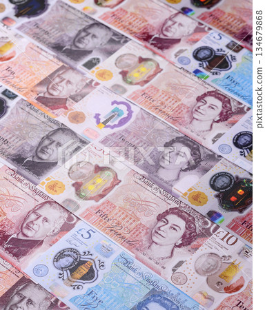 Britain paper money, pound sterling, cash banknotes for financial transactions. Britain money 134679868