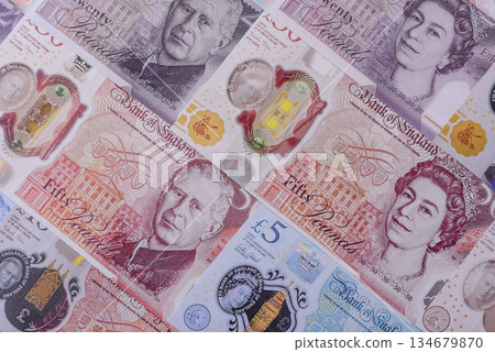 Britain paper money, pound sterling, cash banknotes for financial transactions. Britain money 134679870
