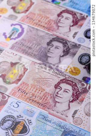 Britain paper money, pound sterling, cash banknotes for financial transactions. Britain money Britain paper money, pound sterling, cash banknotes for financial transactions. Britain money 134679872