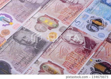 Britain paper money, pound sterling, cash banknotes for financial transactions. Britain money Britain paper money, pound sterling, cash banknotes for financial transactions. Britain money 134679873