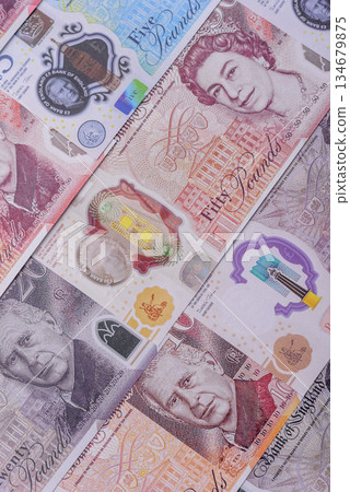 Britain paper money, pound sterling, cash banknotes for financial transactions. Britain money 134679875