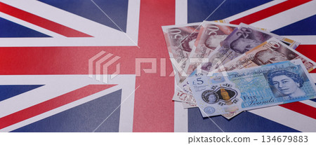 Britain paper money, pound sterling, cash banknotes for financial transactions. Britain money Britain paper money, pound sterling, cash banknotes for financial transactions. Britain money 134679883