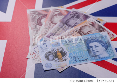 Britain paper money, pound sterling, cash banknotes for financial transactions. Britain money Britain paper money, pound sterling, cash banknotes for financial transactions. Britain money 134679884