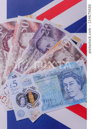 Britain paper money, pound sterling, cash banknotes for financial transactions. Britain money 134679886