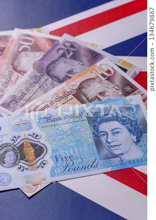 Britain paper money, pound sterling, cash banknotes for financial transactions. Britain money Britain paper money, pound sterling, cash banknotes for financial transactions. Britain money 134679887