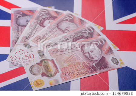 Britain paper money, pound sterling, cash banknotes for financial transactions. Britain money 134679888