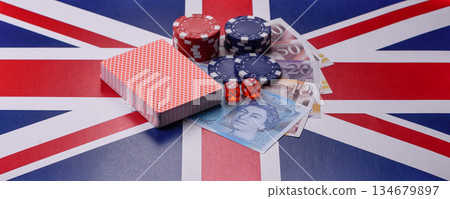 Casino game in the Great Britain, pound sterling money, chips, cards. Gambling in the England Casino game in the Great Britain, pound sterling money, chips, cards. Gambling in the England 134679897