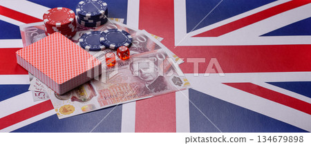 Casino game in the Great Britain, pound sterling money, chips, cards. Gambling in the England Casino game in the Great Britain, pound sterling money, chips, cards. Gambling in the England 134679898