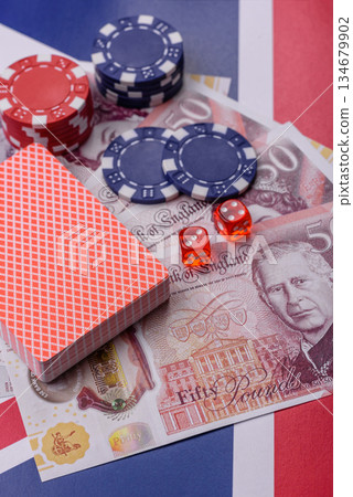 Casino game in the Great Britain, pound sterling money, chips, cards. Gambling in the England 134679902
