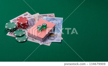 Casino game in the Great Britain, pound sterling money, chips, cards. Gambling in the England Casino game in the Great Britain, pound sterling money, chips, cards. Gambling in the England 134679909