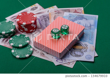 Casino game in the Great Britain, pound sterling money, chips, cards. Gambling in the England Casino game in the Great Britain, pound sterling money, chips, cards. Gambling in the England 134679910