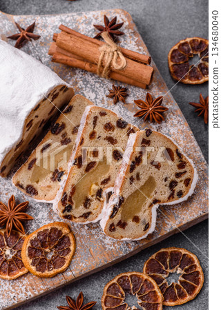 Stollen, a German Christmas pastry for the winter holidays. Stollen as a food background 134680040