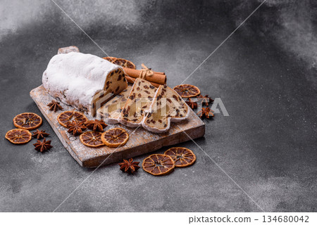 Stollen, a German Christmas pastry for the winter holidays. Stollen as a food background 134680042