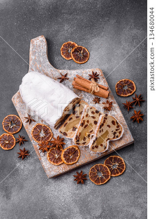 Stollen, a German Christmas pastry for the winter holidays. Stollen as a food background 134680044