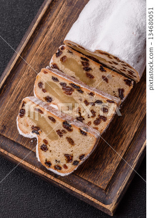 Stollen, a German Christmas pastry for the winter holidays. Stollen as a food background 134680051