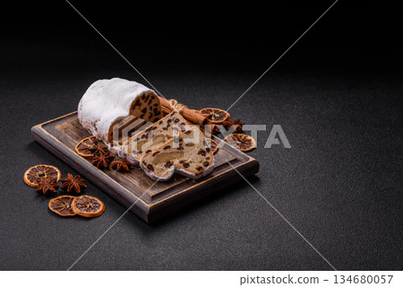 Stollen, a German Christmas pastry for the winter holidays. Stollen as a food background 134680057