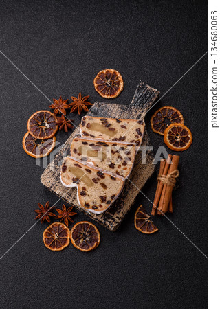 Stollen, a German Christmas pastry for the winter holidays. Stollen as a food background Stollen, a German Christmas pastry for the winter holidays. Stollen as a food background 134680063