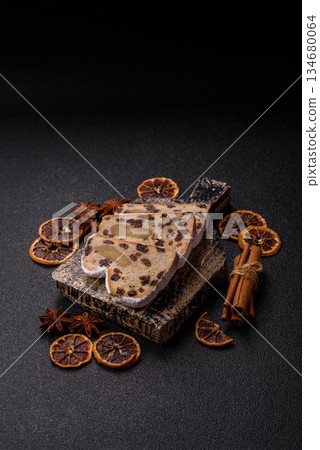 Stollen, a German Christmas pastry for the winter holidays. Stollen as a food background Stollen, a German Christmas pastry for the winter holidays. Stollen as a food background 134680064