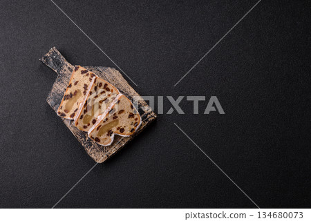 Stollen, a German Christmas pastry for the winter holidays. Stollen as a food background 134680073