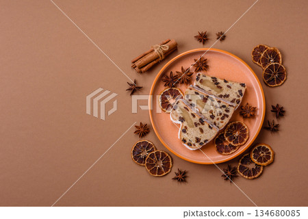 Stollen, a German Christmas pastry for the winter holidays. Stollen as a food background 134680085