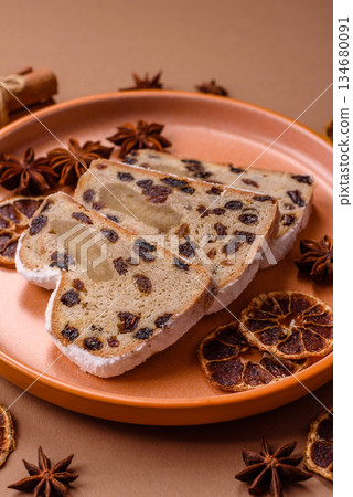 Stollen, a German Christmas pastry for the winter holidays. Stollen as a food background 134680091