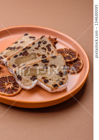 Stollen, a German Christmas pastry for the winter holidays. Stollen as a food background 134680095