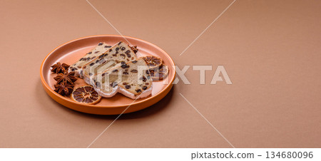 Stollen, a German Christmas pastry for the winter holidays. Stollen as a food background 134680096