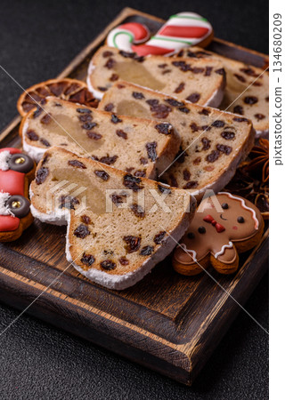 Stollen, a German Christmas pastry for the winter holidays. Stollen as a food background 134680209