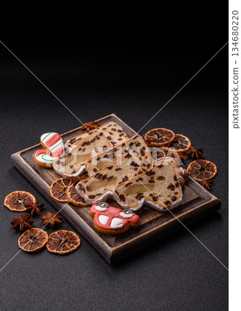 Stollen, a German Christmas pastry for the winter holidays. Stollen as a food background 134680220